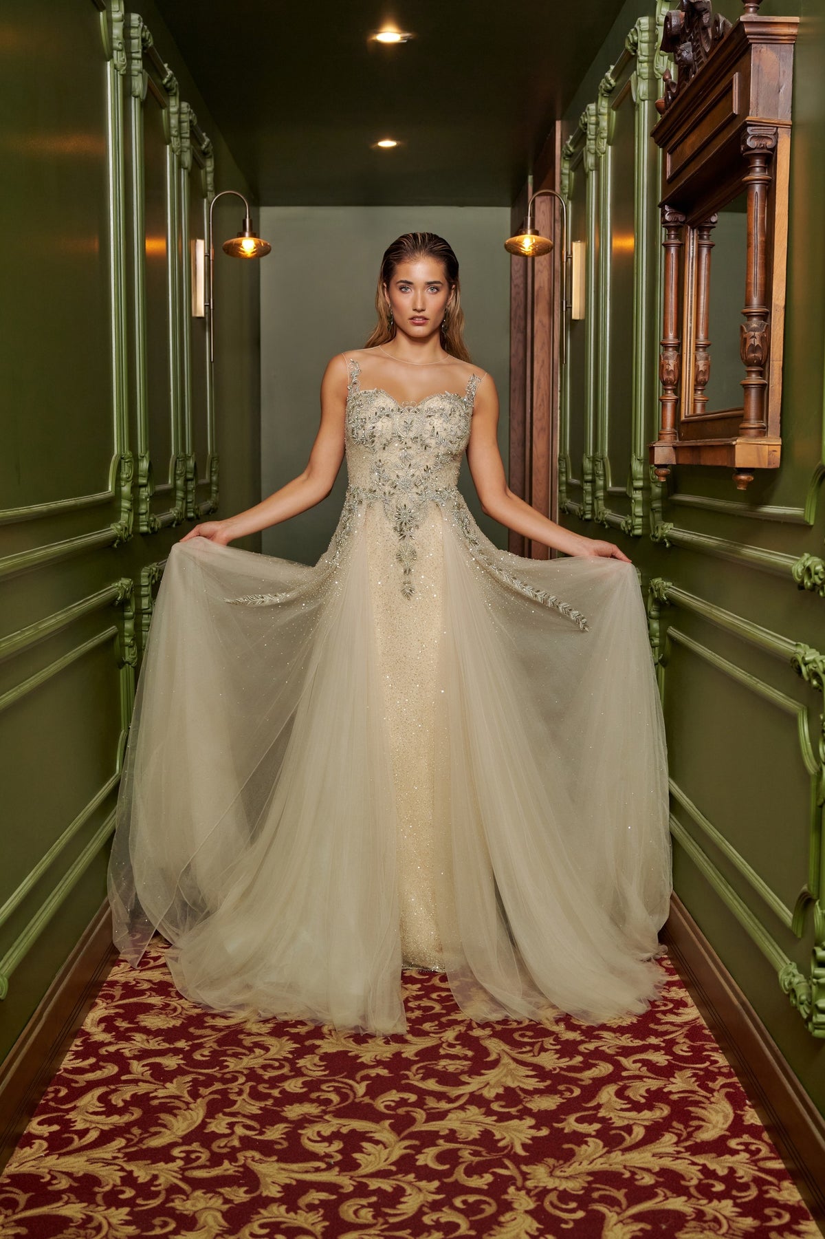Ivory Dream floor-length evening gown with an embellished fitted bodice, delicate straps and a flowing overskirt.