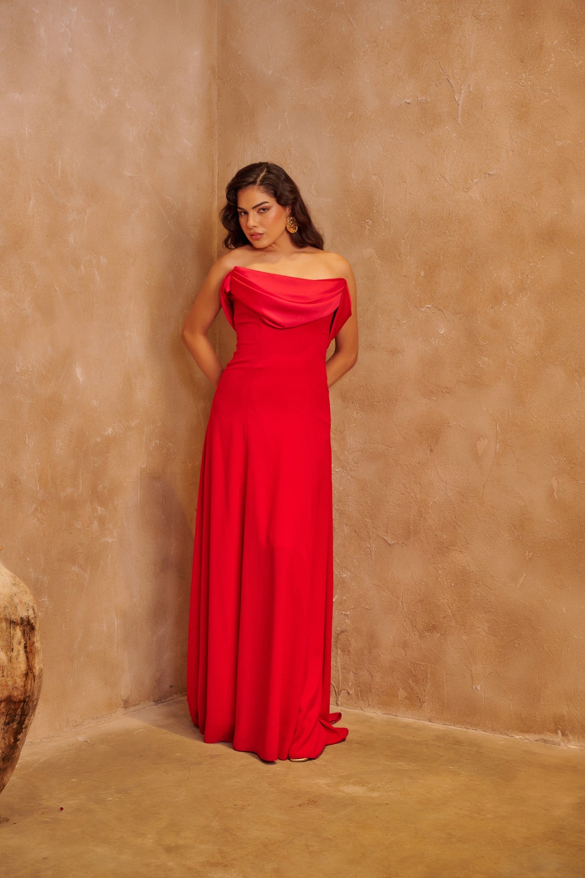 Scarlet Allure red satin gown with a strapless draped neckline and sleek floor-length silhouette.