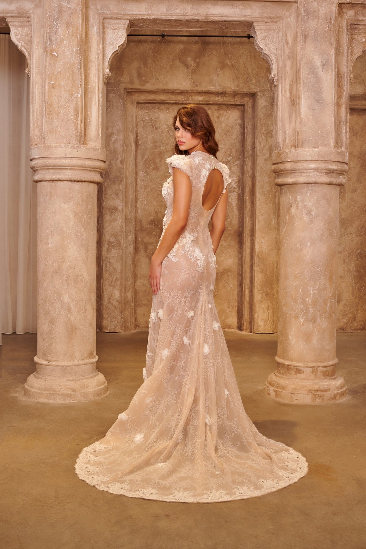 Ivory Lace white evening dress with a high neckline, sheer fitted bodice, floral appliqués and a front slit.