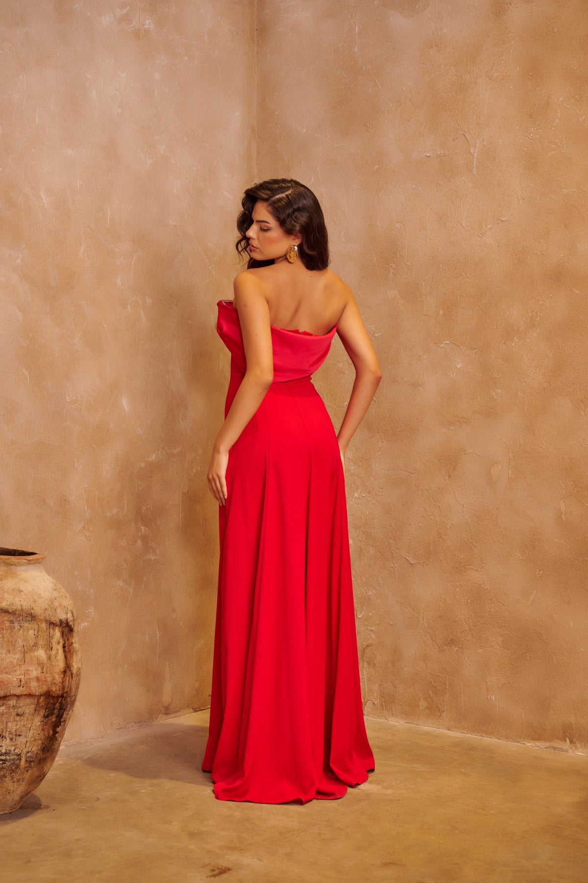 Scarlet Allure red satin gown with a strapless draped neckline and sleek floor-length silhouette.