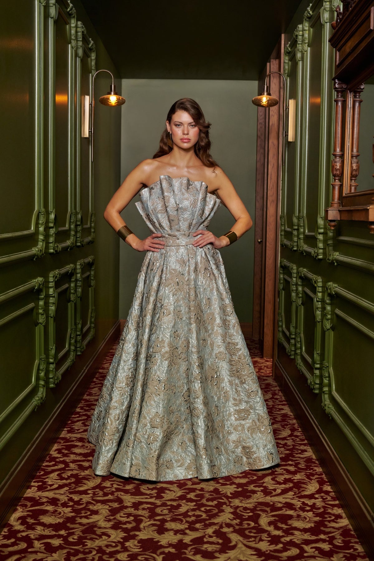Silver Bloom strapless silver ball gown with a sculptural petal bodice and voluminous floral-patterned skirt.