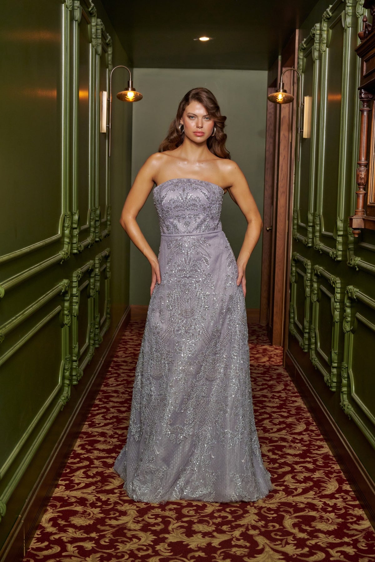 Silver Mist strapless silver grey evening gown with intricate beadwork, a fitted bodice and a floor-length A-line skirt.