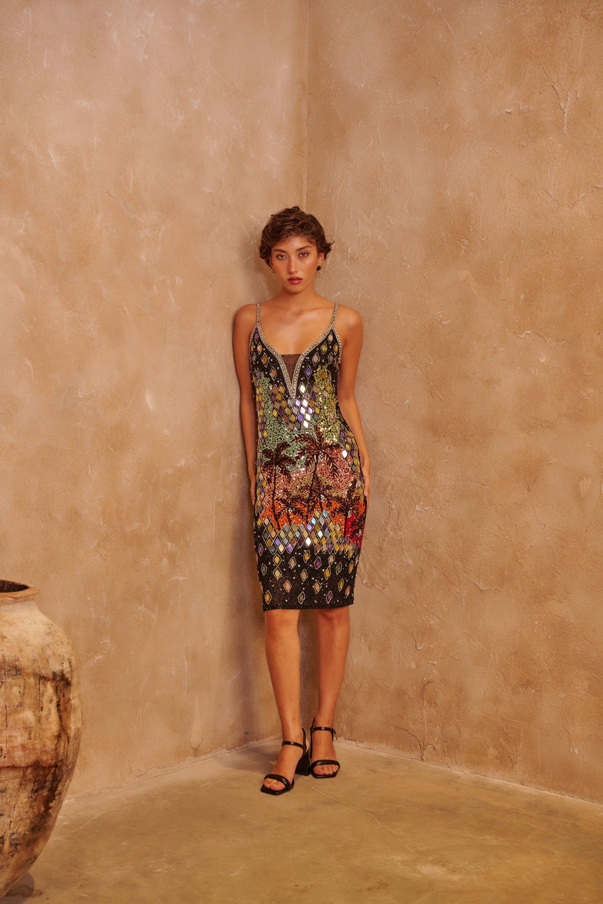 Mosaic Fire black fitted dress with multicolored mosaic sequins, a sleeveless neckline and a sleek silhouette.