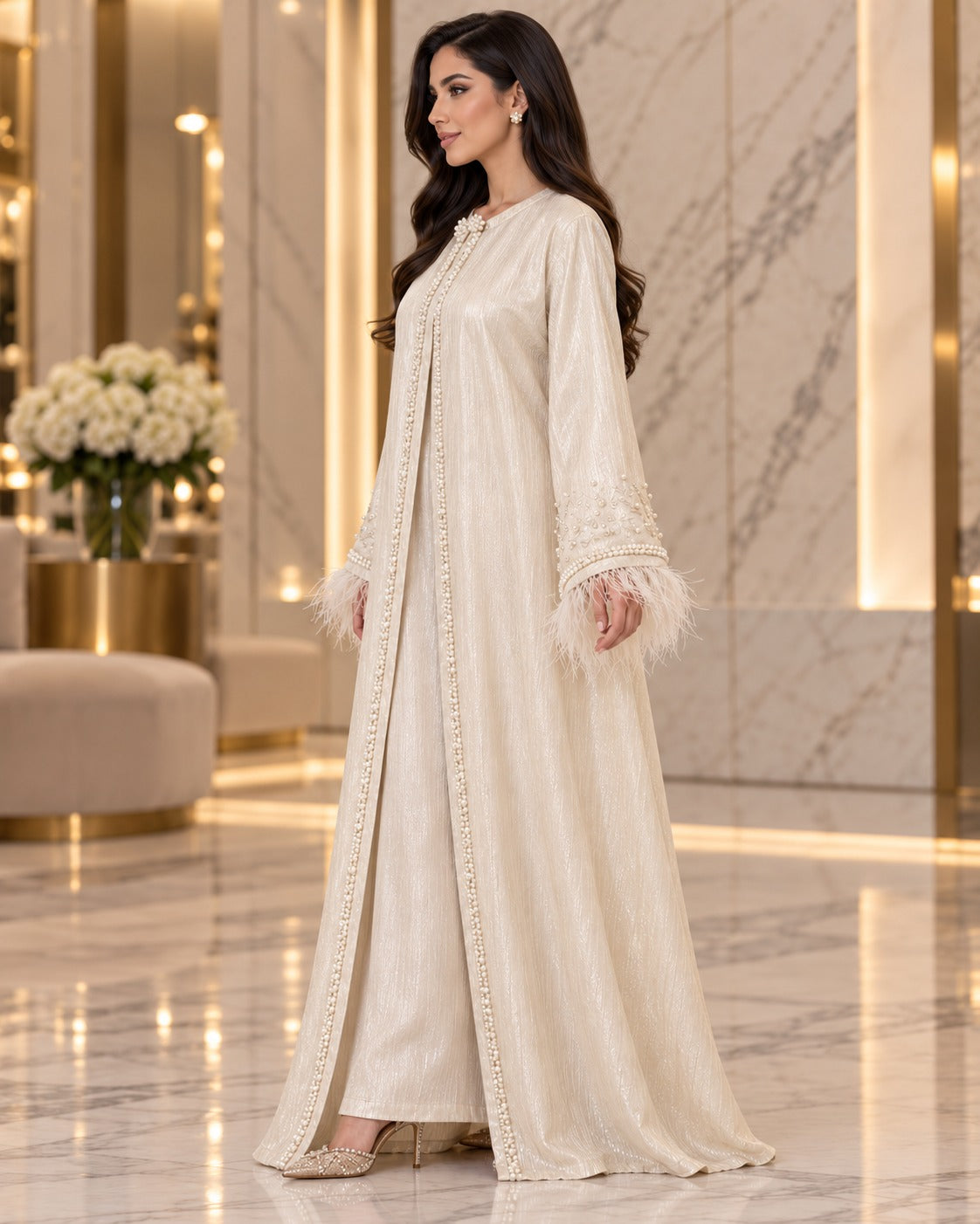 Lulu ivory open-front abaya with pearl-style beaded detailing, long sleeves, feather-trim cuffs and a subtle textured sheen, side view