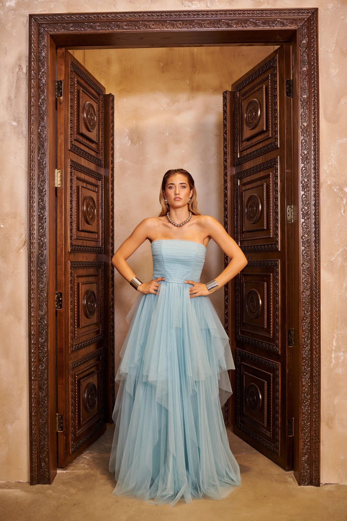 Blue Cloud powder blue ball gown with a strapless ruched bodice and a voluminous skirt with soft asymmetric layers.