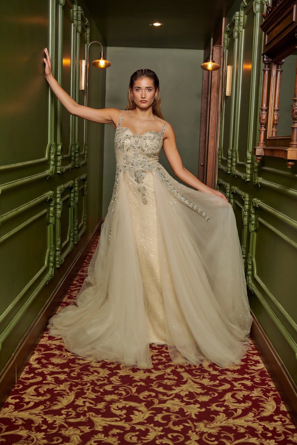 Ivory Dream floor-length evening gown with an embellished fitted bodice, delicate straps and a flowing overskirt.