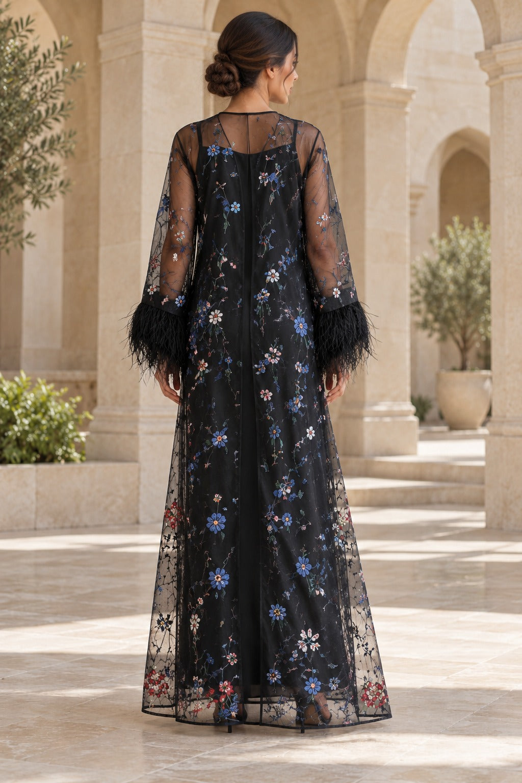 Layali black open-front abaya with sheer sleeves, multicolour floral detailing and statement feather-trim cuffs, back view