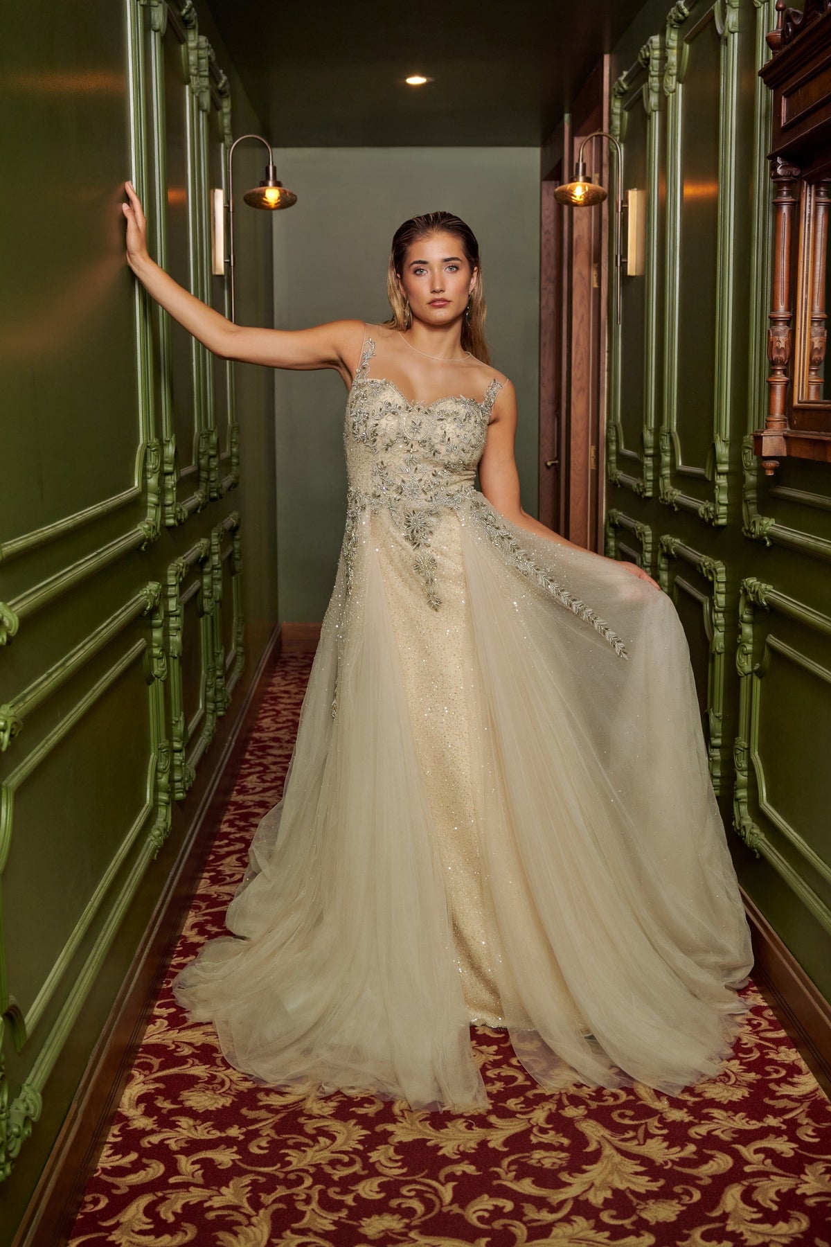 Ivory Dream floor-length evening gown with an embellished fitted bodice, delicate straps and a flowing overskirt.