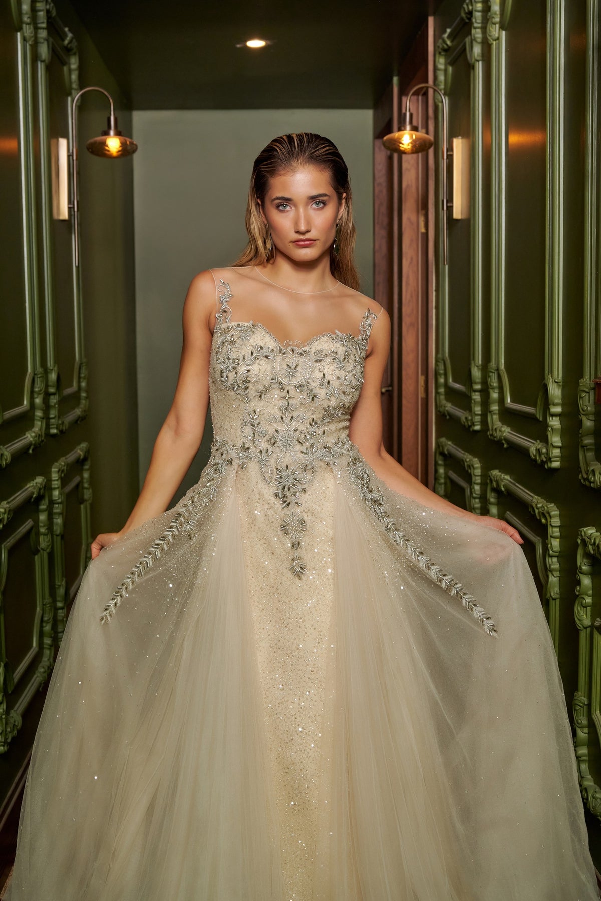 Ivory Dream floor-length evening gown with an embellished fitted bodice, delicate straps and a flowing overskirt.