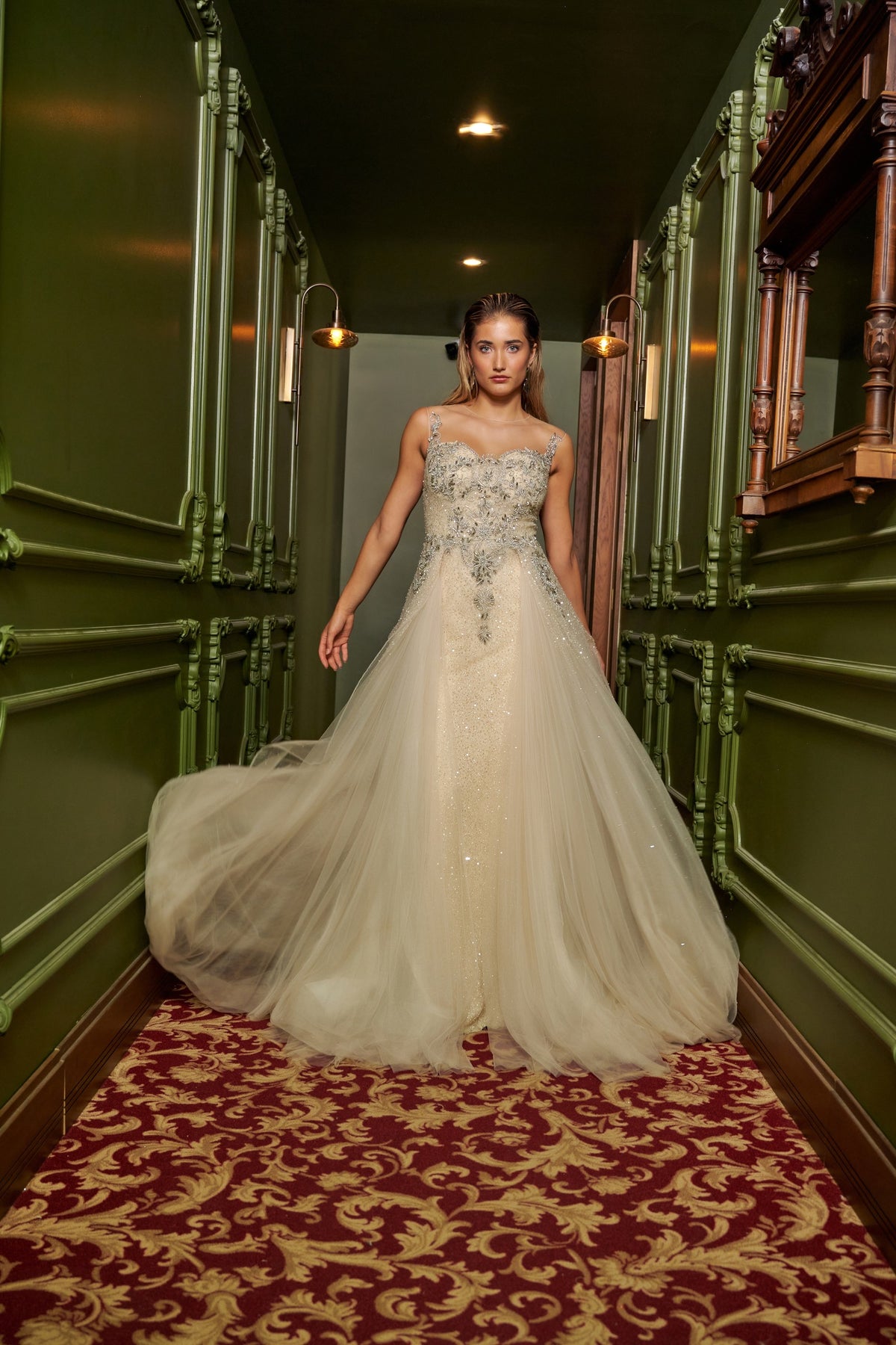 Ivory Dream floor-length evening gown with an embellished fitted bodice, delicate straps and a flowing overskirt.