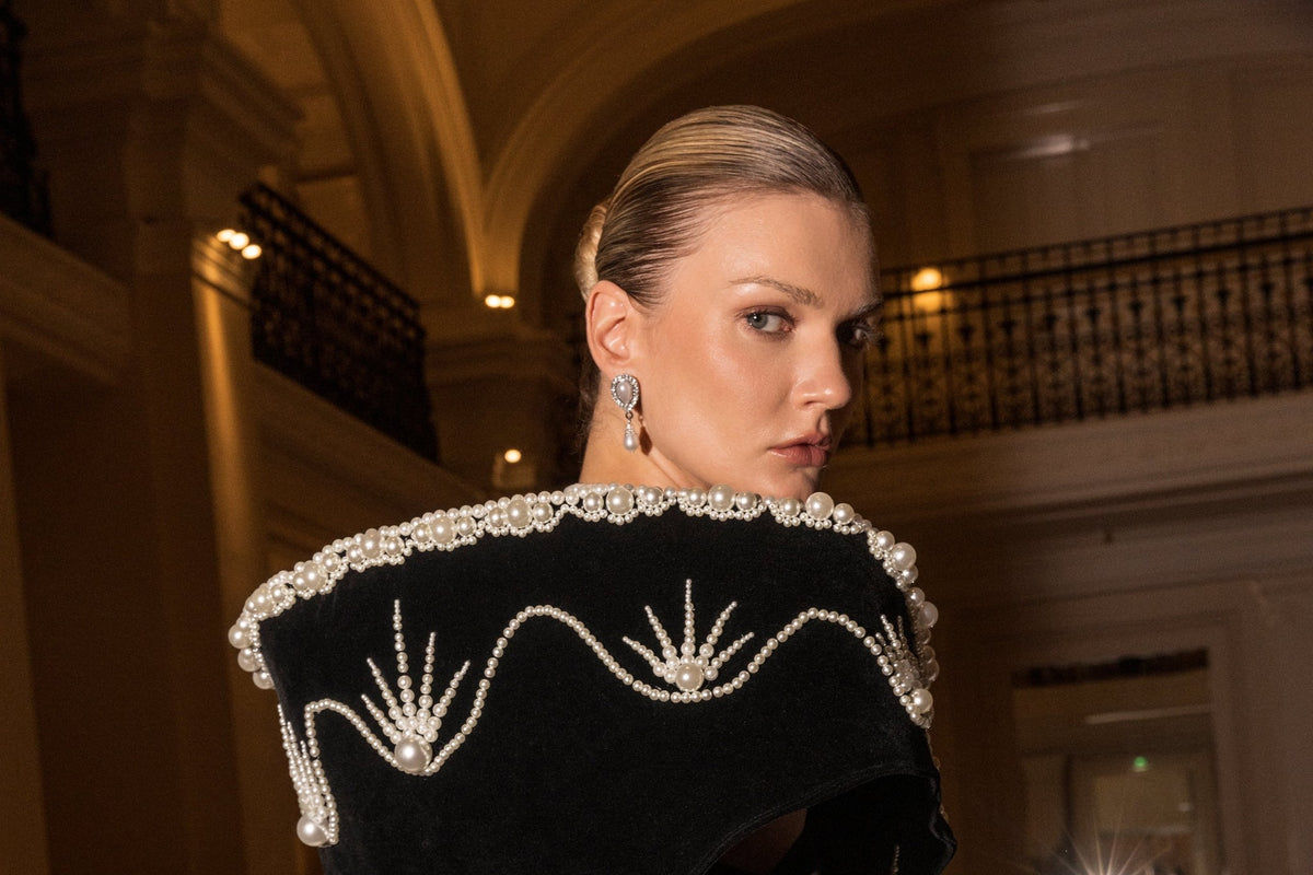 Back to Black collection — model in black velvet with pearl-embroidered collar